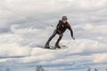 Fagersta, Sweden - Maj 01, 2020: Teenagers make an extreme jump on wakeboarding and looking at the camera, around there are a lot