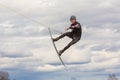 Fagersta, Sweden - Maj 01, 2020: Teenagers make an extreme jump on wakeboarding and looking at the camera, around there are a lot