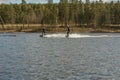 Fagersta, Sweden - Maj 01, 2020: two teenager wakeboarding on a lake