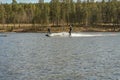 Fagersta, Sweden - Maj 01, 2020: Two teenagers wakeboarders on a lake during a physical education lesson