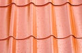 Fagment of red metal roof with many water drops as background Royalty Free Stock Photo