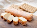 Fagotin cheese with orange coloured rind made from cow milk in caves of Maredsous abbey, Belgium