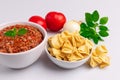 Fagottini Tortellini pasta with Bolognese also know as Bolognesa or Bolonhesa sauce in a white bowl isolated in white background Royalty Free Stock Photo