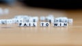 Fail to win slogan in white block bead letters. Motivation inspiration cheer up concept