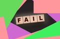 FAIL Word text Written In Wooden Cube blocks on black background. Business crisis concept