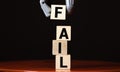 Fail word from wooden blocks on desk