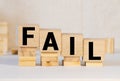 Fail word from wooden blocks on desk