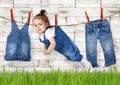 Failed housework creative concept, Funny child hanging on clothe