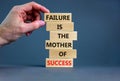 Failure or success symbol. Wooden blocks with words A failure is the mother of success. Beautiful grey table grey background. Royalty Free Stock Photo