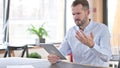 Failure, Young Man with Loss on Tablet in Office