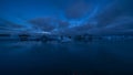 Faint aurora borealis at Jokusarlon Glacial Lagoon, Southeast Iceland