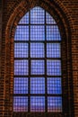 Faint blue light coming from a church Gothic window conveys a celestial, deep feeling with profund, intense and abyssal concept