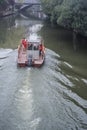 A faint foggy day, a small motor boat driving on the Qinhuai River