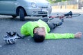 Fainted aching man after bicycle accident Royalty Free Stock Photo