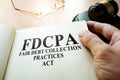 Fair Debt Collection Practices Act FDCPA on a table.