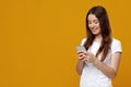 Fair-haired caucasian lady downloading nice applications for smartphone