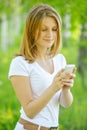 Fair-haired woman looking at phone