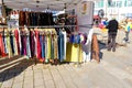 Fair at the market square in the city center, artisans sell self-made goods, shoppers stroll through the sunny city, clothing and