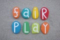 Fair play, respect for the rules, creative text composed with colored stone letters over beach sand Royalty Free Stock Photo