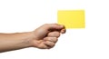 hand holding bright yellow card on white background Royalty Free Stock Photo