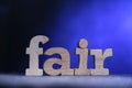 Fair, text words typography written on wooden lettering, life and business motivational inspirational Royalty Free Stock Photo