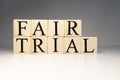 Fair trial word from wooden cubes. About law terms