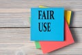 FAIR USE - words on note paper on wooden light background Royalty Free Stock Photo