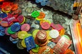 Fairground chips many colors on a gambling pushing slot machine Blur background
