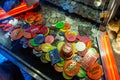 Fairground chips many colors on a gambling pushing slot machine Blur background