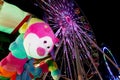 Fairground scene at night with ferris wheel lights