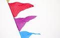 Fairground triangle flag hanging on a rope for a fun party Fiesta event, carnival festival event, Park or street Festa decoration Royalty Free Stock Photo