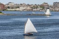 Small sailboat leaving Fairhaven under sail Royalty Free Stock Photo