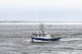 Lobster boat Intimidator with Sconticut Neck in background Royalty Free Stock Photo