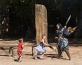 A fairie and two small children at a Renaissance fair