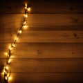 Wood panels on a deck or patio with fairy lights, vignette, blur