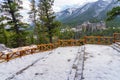 Fairmont Banff Springs and Bow River Falls in snowy autumn sunny day. Banff National Park, Canadian Rockies.