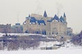 Fairmont ChÃÂ¢teau Laurier castle, seen from across the frozen Ottawa river