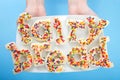 Fairy bread spelled with bread on a plate