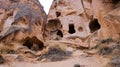 Cave houses surrounded by rock formations in Cappadocia, Turkey Royalty Free Stock Photo
