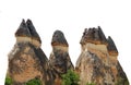 Fairy chimneys isolated in white background. They are towering rock formations in Cappadocia Turkey