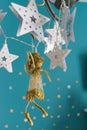 Fairy figurine stars turquoise background