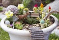 Fairy garden in a flower pot outdoors Royalty Free Stock Photo