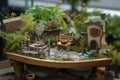a fairy garden with whimsical plants, miniature furniture and a wishing well Royalty Free Stock Photo