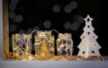 Recycled jars reused as festive holidays window decoration, selective focus