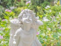 Fairy Statue in the garden with flower