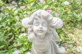Fairy Statue in the garden with flower Royalty Free Stock Photo