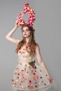 Fairy-tale girl model with floral horns.