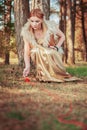 Fairy tale about princess with fatal ball of threads in wood Royalty Free Stock Photo