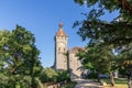 Fairy-tale 14th-century stunning Rocamadour Castle BishopÃ¢â¬â¢s Palace surrounded by green tree garden on cliff summit Royalty Free Stock Photo