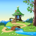 Fairy tale house in an old stump with a green roof Royalty Free Stock Photo